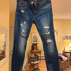 Distressed ankle jeans